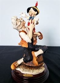 #13 - Giuseppe Armani / Florence Sculture d' Arte "Pinocchio and Geppetto / A Father's Love" #543 - from Disney's Pinocchio. Limited edition 867/1075. Hand signed by Giuseppe Armani.