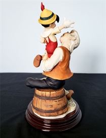 #13 - Giuseppe Armani / Florence Sculture d' Arte "Pinocchio and Geppetto / A Father's Love" #543 - from Disney's Pinocchio. Limited edition 867/1075. Hand signed by Giuseppe Armani.