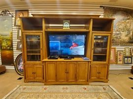 Expandable oak entertainment center!  This is a 47” Panasonic TV - which has great color.  It's a good one!