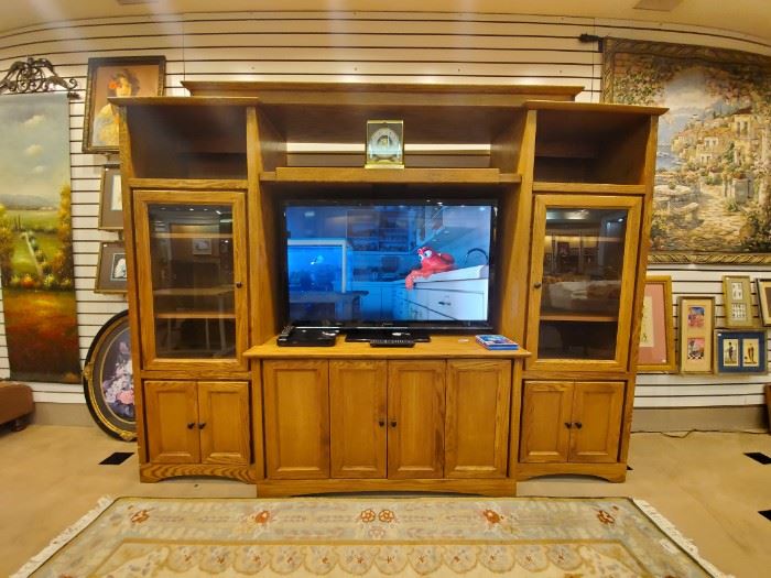 Expandable oak entertainment center!  This is a 47” Panasonic TV - which has great color.  It's a good one!
