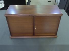 Dunhill Pipe Smokers Tobacco cabinet holds 12 pipes with two drawers & has locking doors.