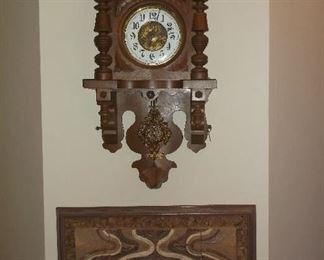 Antique  German wall clock and pottery wall hanging