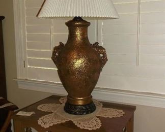 Large gold tone urn lalmp