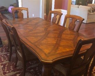 Country French dining table with one leaf, inlaid parquet top w/ six upholstered dining chairs