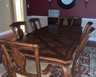  Country French dining table with one leaf, inlaid parquet top w/ six upholstered dining chairs