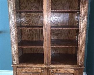 Two piece Oak bookcase with adjustable shelves, bottom storage