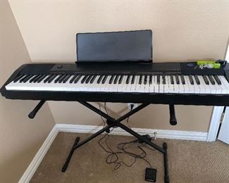 Keyboard piano on stand