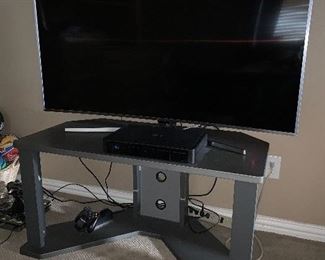 Flat screen TV on stand