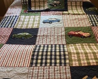 Quilted blanket with truck and car motif