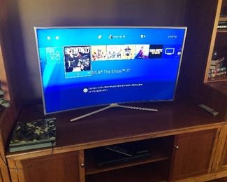 Samsung Curved Flat screen TV on stand