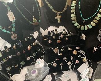 Sterling silver jewelry with turquoise, precious stones, and semi precious stones