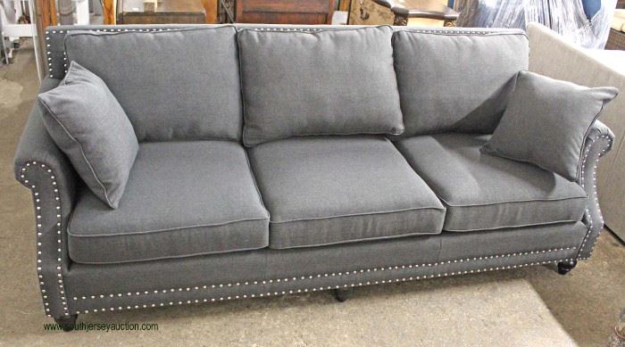 NEW Contemporary Grey Upholstered Sofa with Throw Pillows
Located Inside – Auction Estimate $300-$600