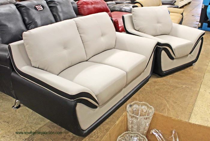 NEW Contemporary “Global” Leather Black and Grey Modern Design Sofa and Chair
Auction Estimate $400-$800 – Located Inside