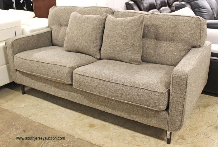 NEW “Ashley Furniture” Upholstered Contemporary Sofa with Decorator Throw Pillows (Model MAWKDO)
Auction Estimate $300-$600 – Located Inside