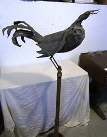 Large iron rooster sculpture, signed by artist Doug Makemson, 1990.  Stand about 5 ft. tall.