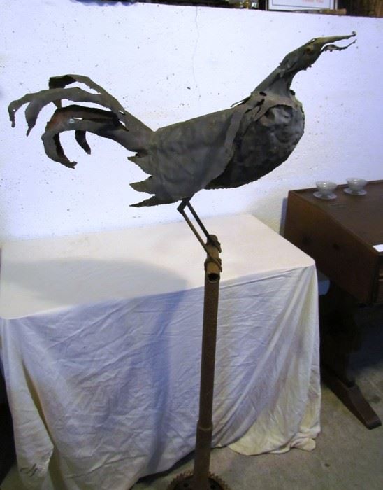 Large iron rooster sculpture, signed by artist Doug Makemson, 1990.  Stand about 5 ft. tall.