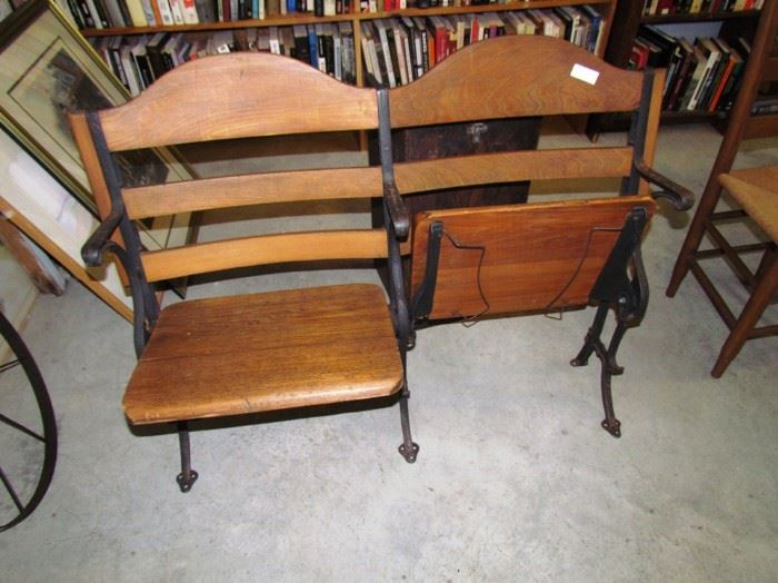 Theater or courthouse seats, with hat holders under the seats