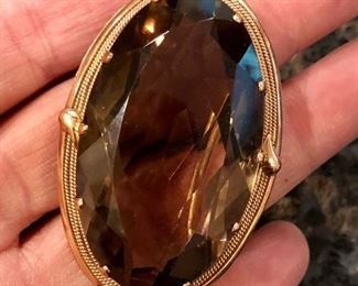 Large smoky topaz in gold
