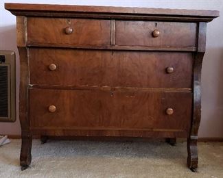 Sm-med size antique dresser w/metal wheels 