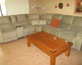 Like-New 3 Piece Sectional by Ashley Furniture. Barely 2 years old and a beautiful unit! Reclining Sections and a Suede-Like Pewter Color Upholstery. Overall Size: 10' X 10'