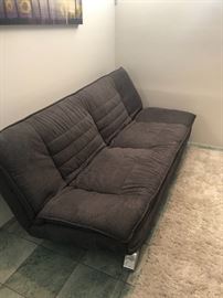 Modern Futon sofa, grey area rug - Purchased at Scandinavian Home