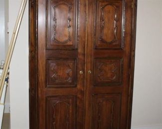 Carved wood armoire