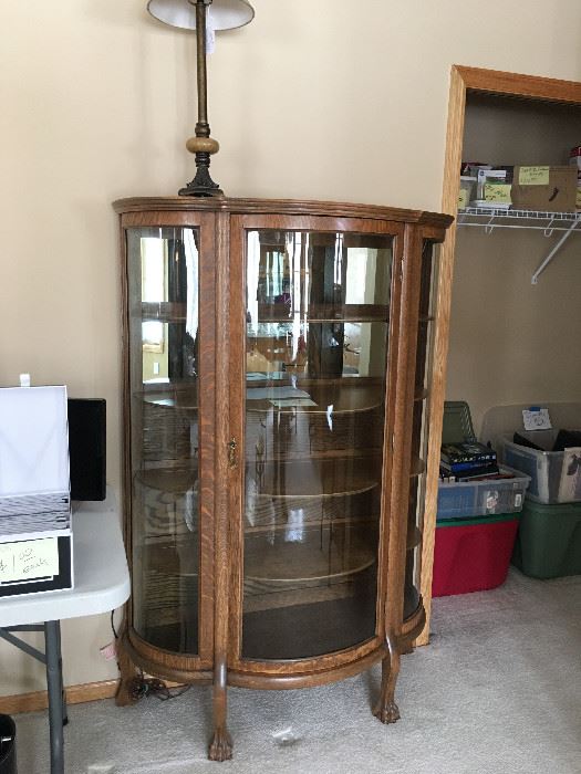 Oak curved glass curio cabinet; perfect for displaying your prized pottery collection, glassware, dishware, or other treasured collections