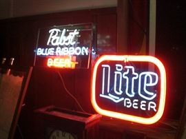 several neon beer signs