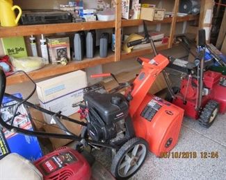 2 snow throwers and 2 lawn mowers