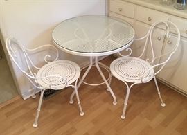 White Wrought Iron Bistro set with custom cut glass top. Like new!