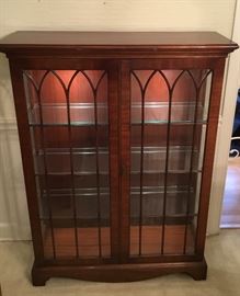 Beautiful 5 ft Curio Cabinet/Bookcase/Trinket Cabinet. Comes equipped with lighting, glass shelving, and gothic double door design. Versatile enough to be either formal or informal.