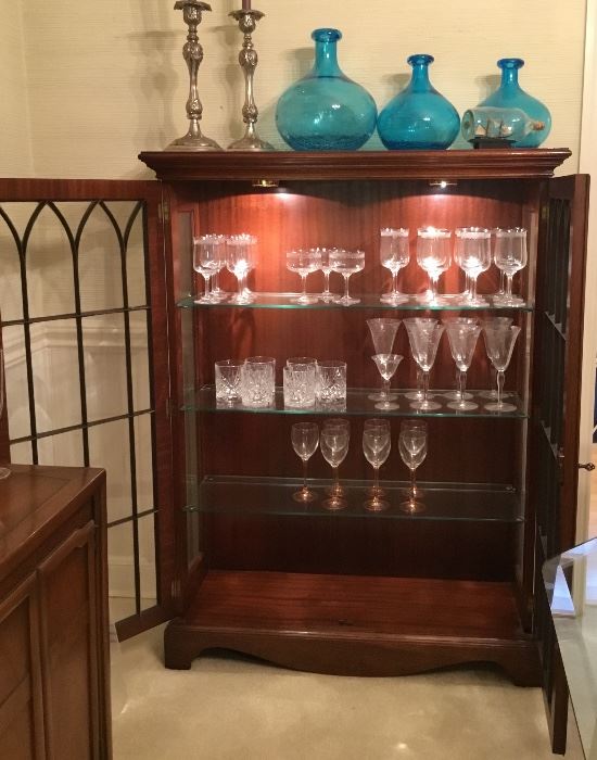 Curio/Bookcase/ Trinket Cabinet displaying beautiful bar glasses , This pic shows the depth of the shelves and highlights the lighting showcasing the beautiful wood grain and glass shelves. 
