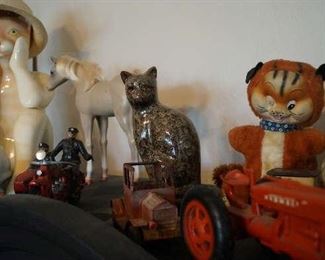 Cats, iron tractors, motorcycle