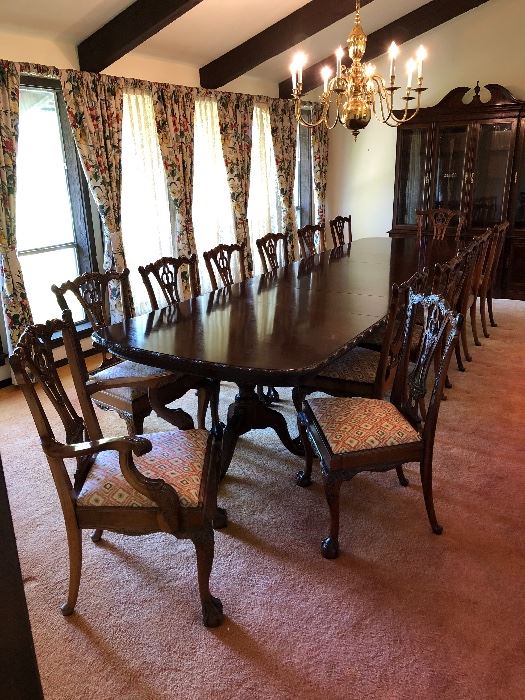 Long formal dining room table (3 pedestals) with 2 removable extension leaves and 14 dining room chairs & china cabinet.