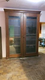Very large display/book case with extra shelving - very old, top molding comes off.