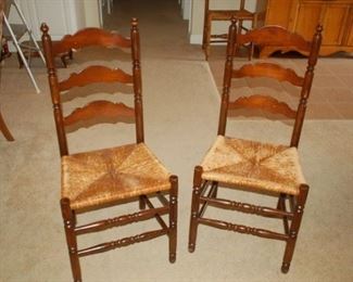 Two of four vintage weaved bottom high back chair