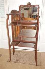 Stunning antique shelf with beveled mirror back