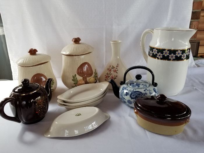 Collection of vintage to new pottery cookie jars, teapots, vases, and dishes https://ctbids.com/#!/description/share/136922