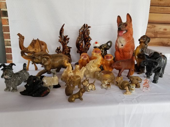 Collection of vintage pottery and wood animal figurines.    https://ctbids.com/#!/description/share/136926