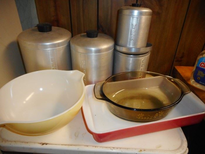 Vintage Kitchen in the Basement. Pyrex Yellow Batter Bowl, Alum Canisters, Pyrex Visions. Pyrex Flamingo Pink Utility Dish 