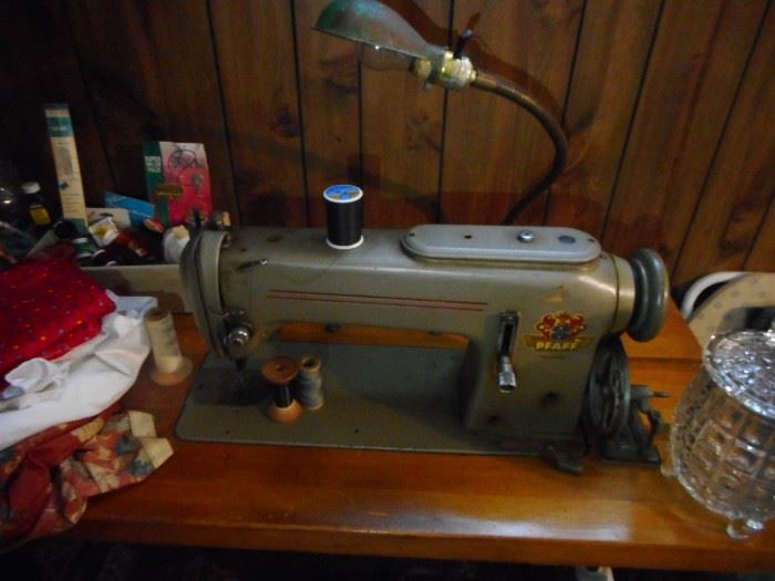 Industrial Vintage Pfaff Sewing Machine ,with Walking Foot, and has Motor..does it work? I dont sew..so I dont know..Has Little Lamp over sewing machine..and that needs to be re wired. 