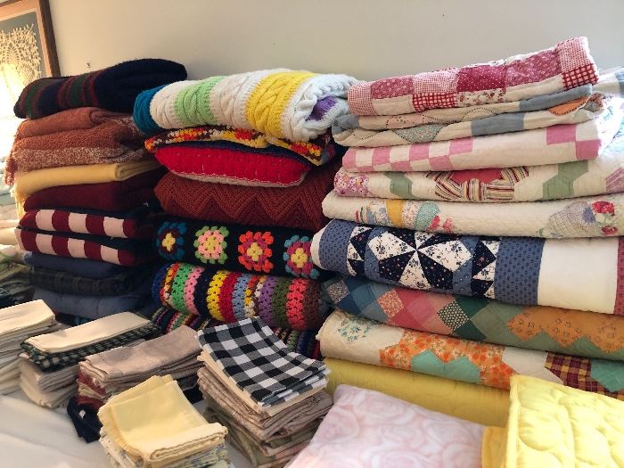 FULL room of new and gently used linens, quilts, Afghans, blankets, tableblothes, placemats and so much more! 