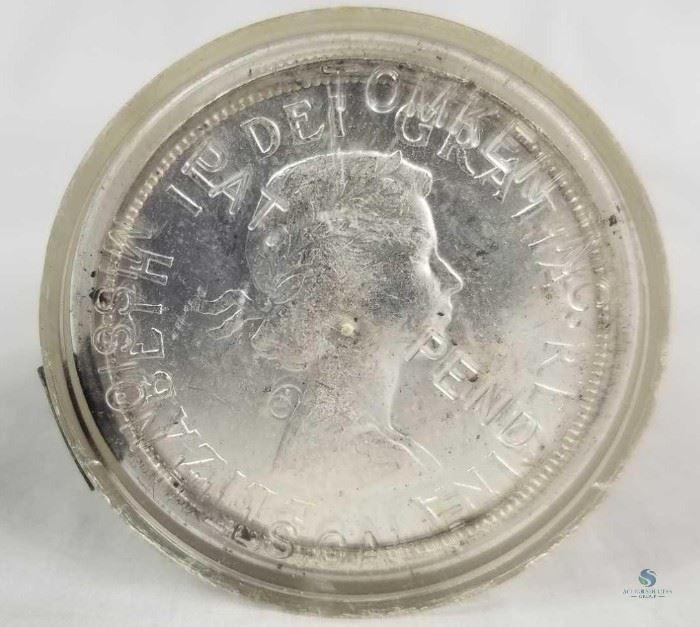 Roll of 20 Canada Uncirculated 1963 Silver Dollars / Elizabeth II on obverse, famous canoe design on reverse. Brilliant uncirculated coins. A full 12 troy ounces of silver.
