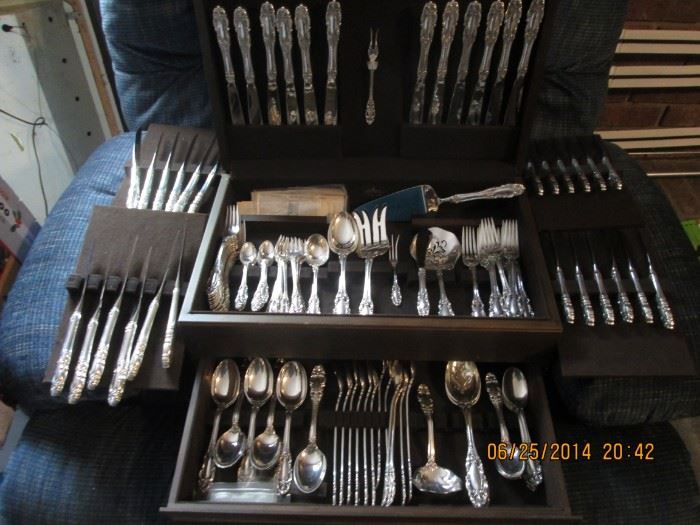 sterling service for 12 knives, butter knives steak knives spoons, iced tea spoons soup spoons, demitasse spoons. salad forks, forks, cocktail forks  plus serving pieces. Closest to new and complete set I've seen.