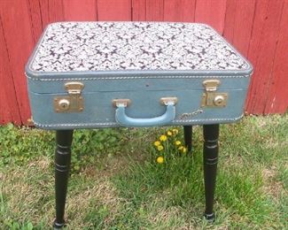 Small, cute table made from a suitcase.  Great storage.