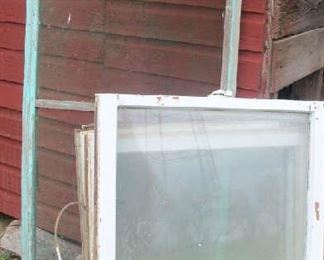 Screen and assortment of old windows.