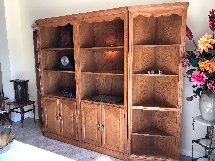 Four-section oak finish display shelves, sold separately or together - $495 (Includes 2 end/corner 5-shelf units - $55 EA, 2 wall units w/3 shelves and lower cupboard - $195 EA) 
