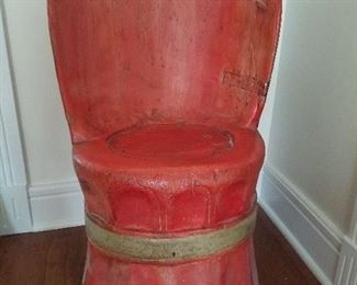 Kubbestol log cut chair painted red.
