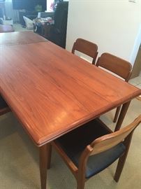 Beautiful condition teak table & 12 chairs ...in excellent condition with self storage leafs  chairs designed by Henning Kjaernulf for Vejle Mobelfabrik