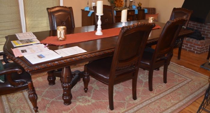 Very nice carved Mahogany long dining table & (6) leather chairs 
